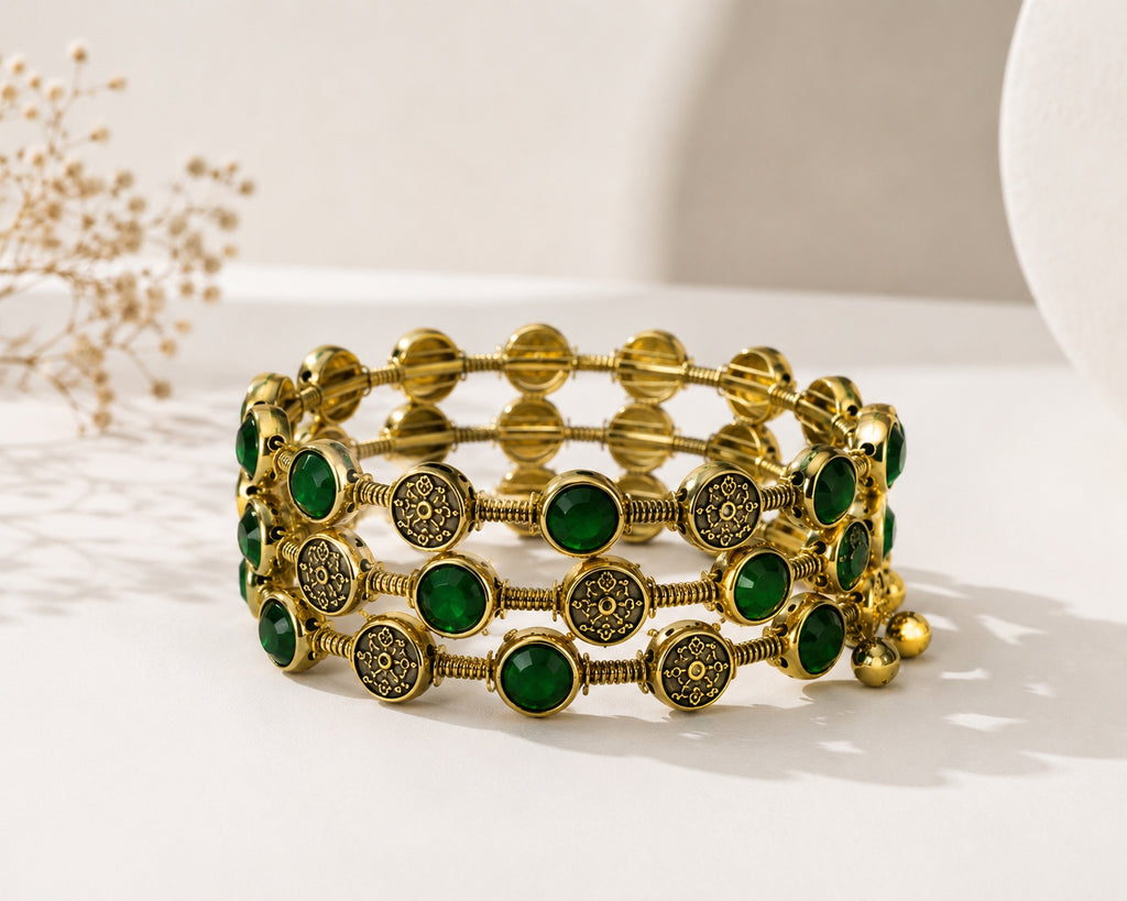 Model wearing emerald green bangle set with navy blue saree