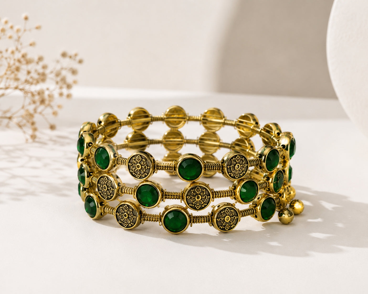 Model wearing emerald green bangle set with navy blue saree