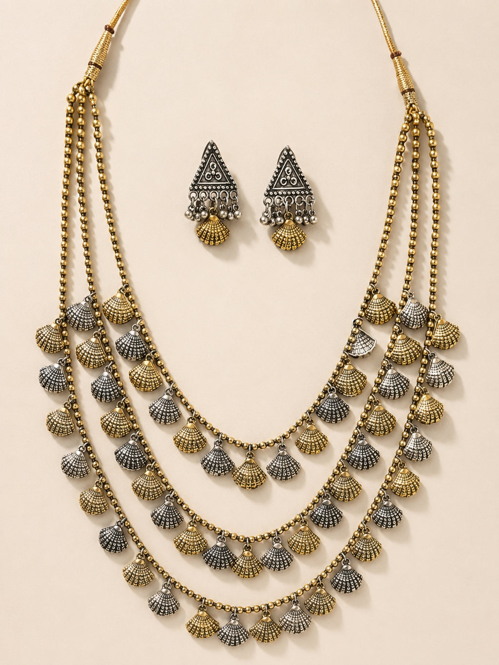 Antique brass ethnic necklace on velvet