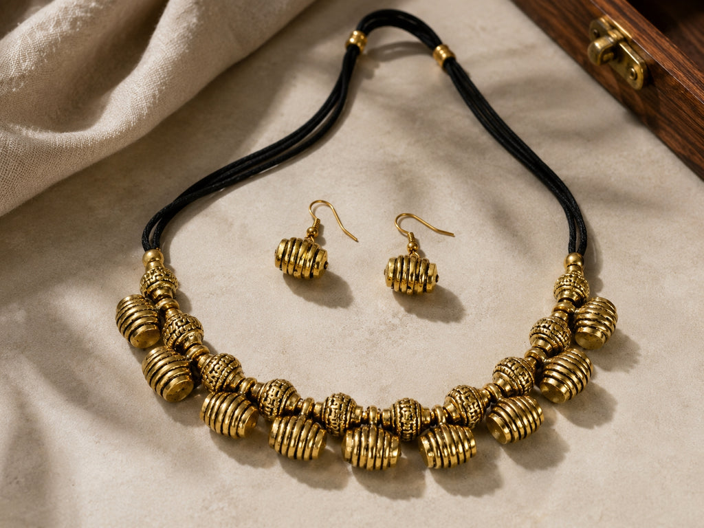 Antique Brass Bead Necklace Set on white fabric