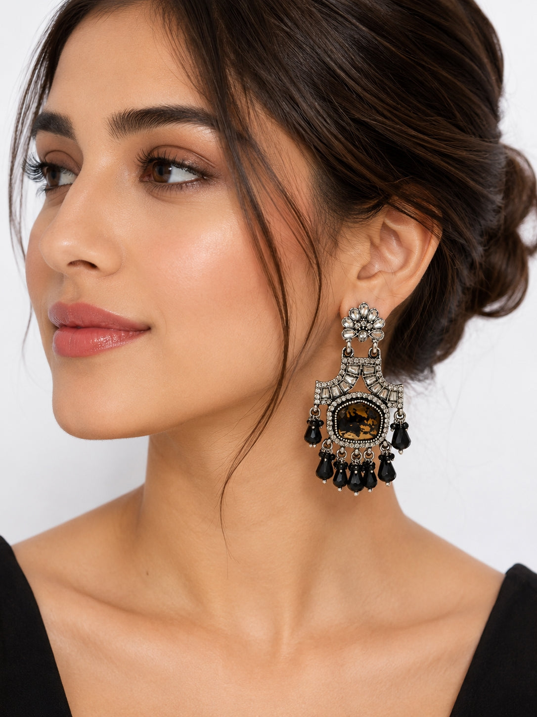 Black antique chandelier earrings on red velvet - Velvet Petals