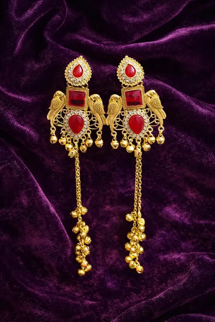 Kashmiri gold plated jhumka earrings with red stone on purple velvet