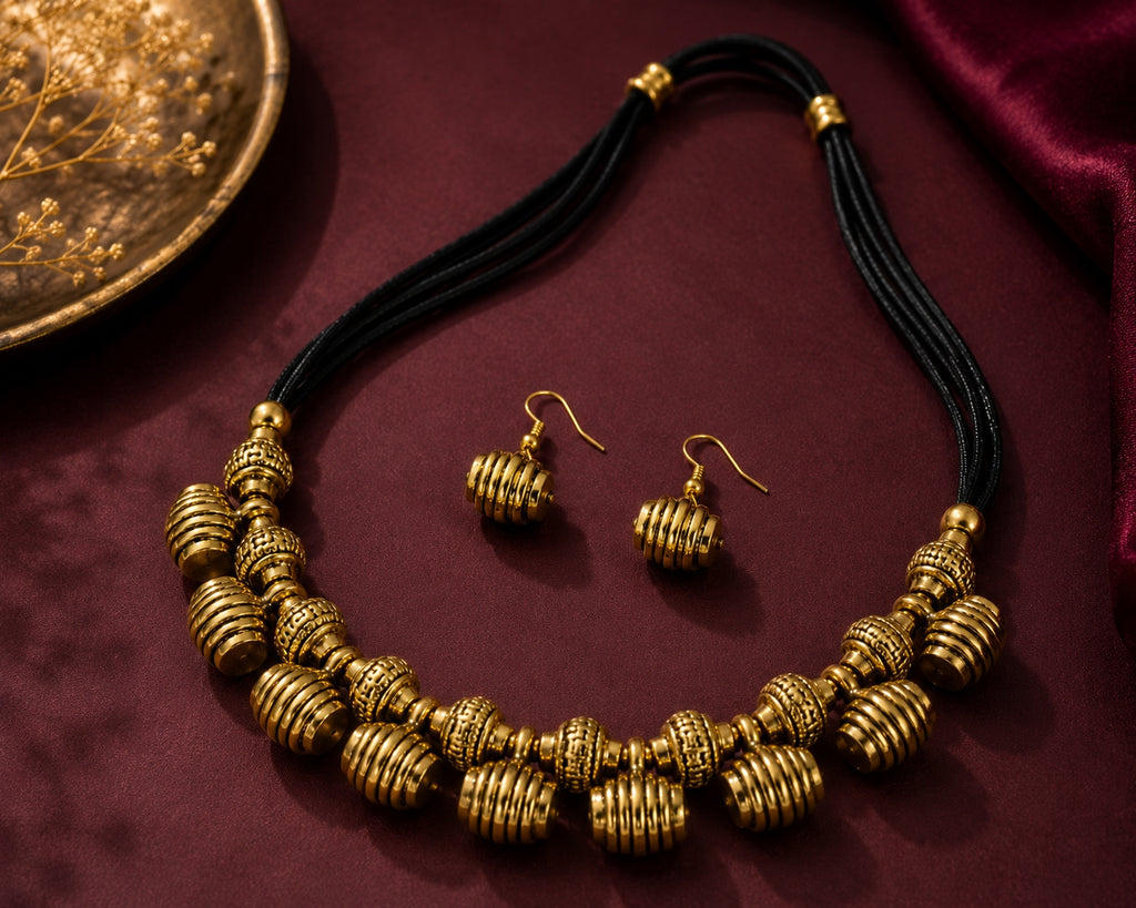 Antique brass necklace and earrings minimalist flat lay