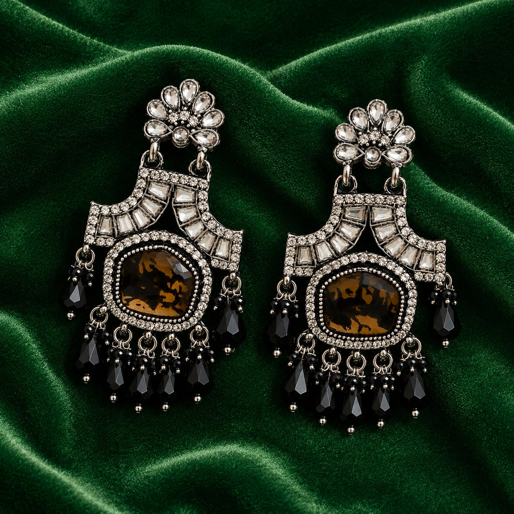 Black antique chandelier earrings on green velvet - Velvet Petals