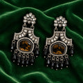 Black antique chandelier earrings on green velvet - Velvet Petals