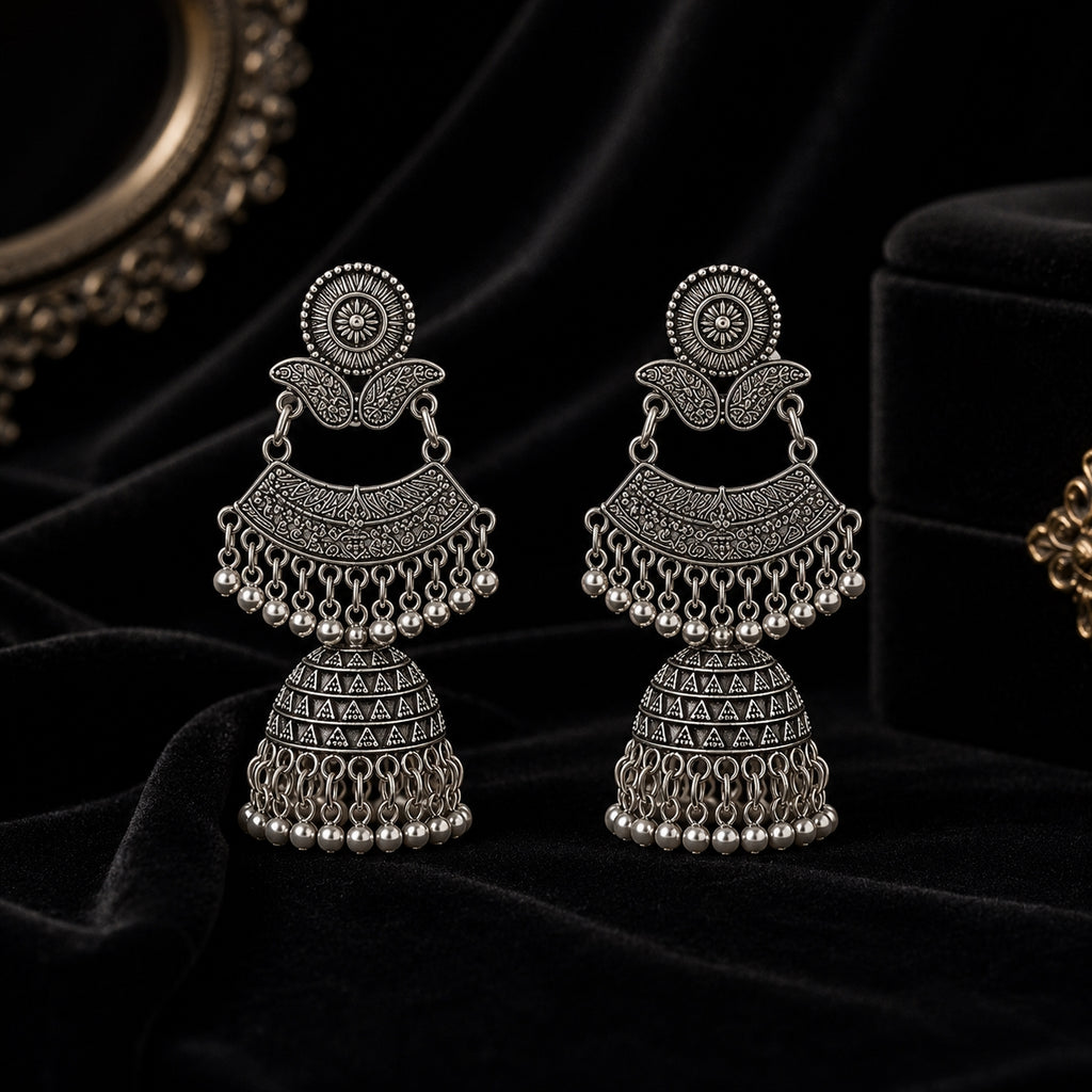 Oxidised silver double decker jhumka earrings on black velvet