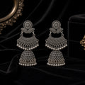 Oxidised silver double decker jhumka earrings on black velvet