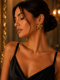Gold Floral Stud Earrings worn by model in evening setting
