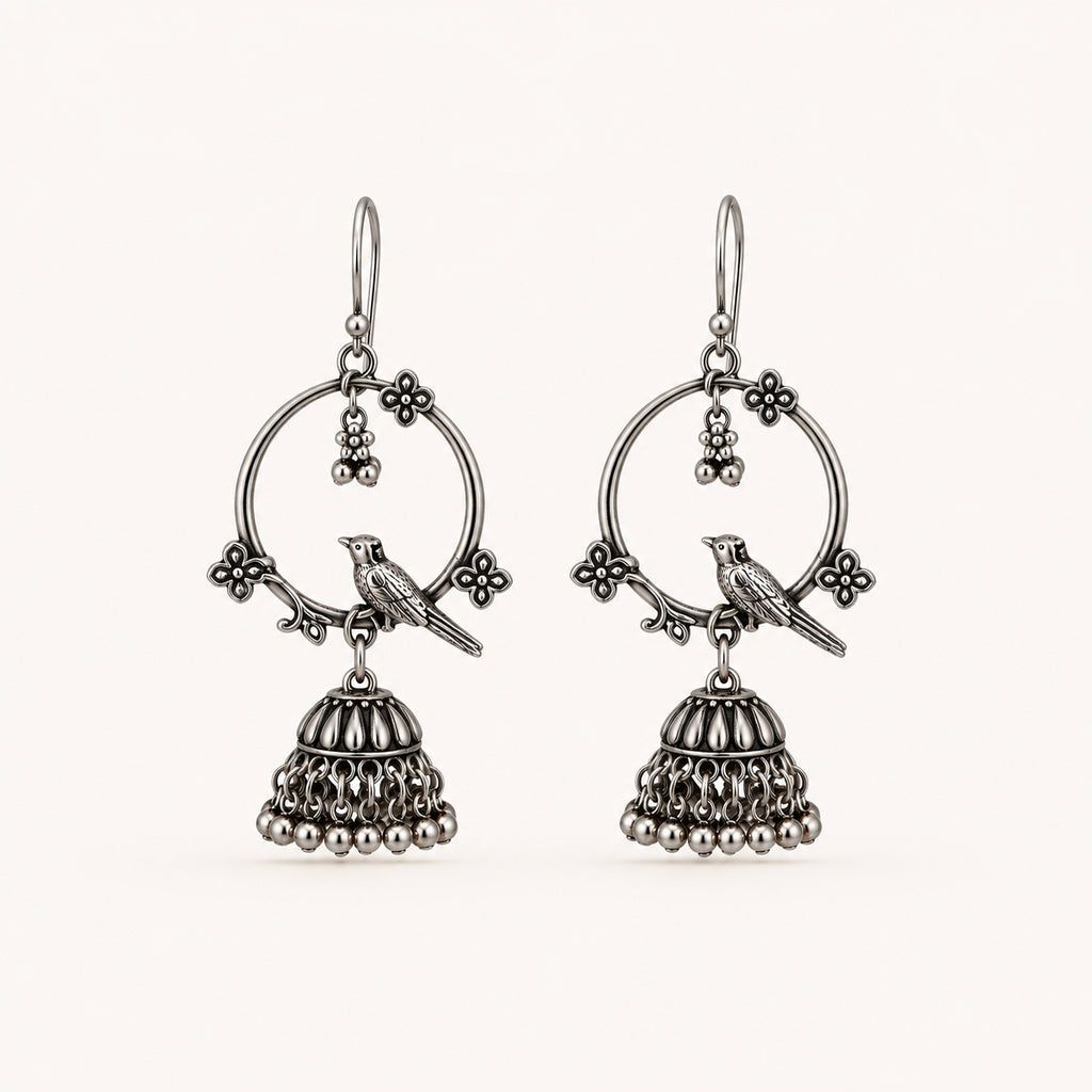 Oxidised silver bird jhumka earrings on white background