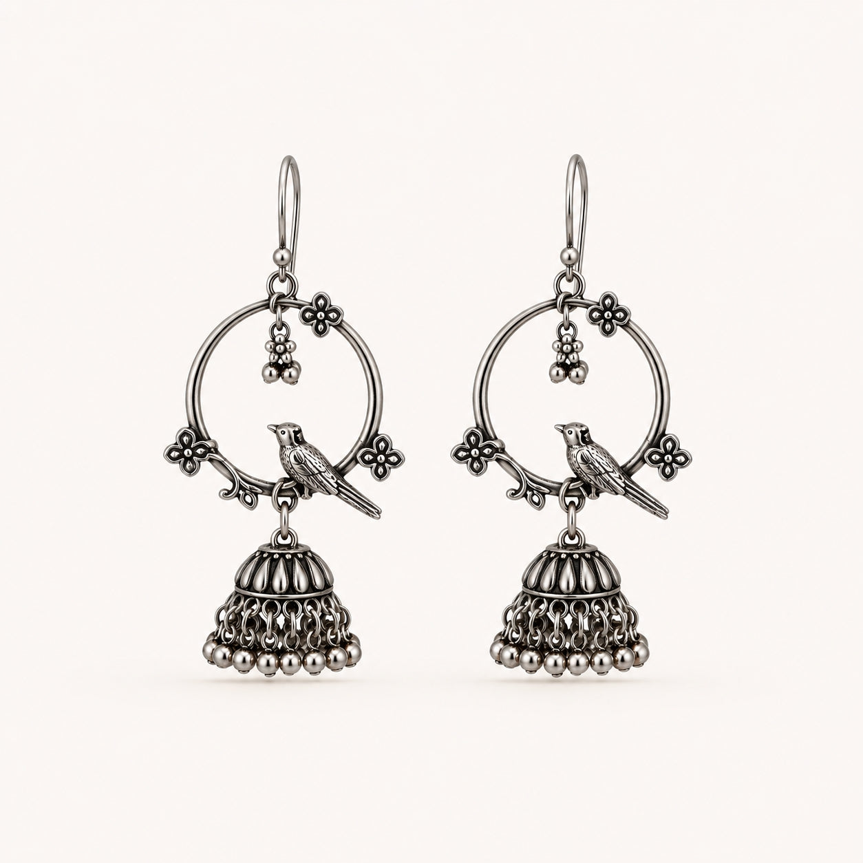 Oxidised silver bird jhumka earrings on white background