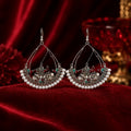 Oxidised silver Kashmiri chandbali earrings with pearl border on red velvet